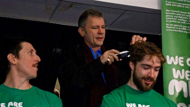 IRON MAIDEN Frontman BRUCE DICKINSON Shaves Heads For BraveTheShave Campaign At Cardiff Devils Game; Video